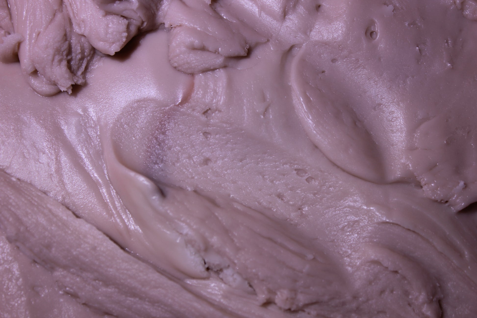 Close-up of purple cream or frosting with a smooth texture